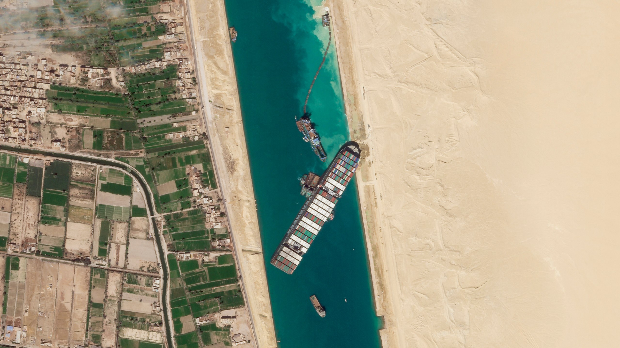 In this March 28, 2021, satellite file image from Planet Labs Inc, the cargo ship MV Ever Given sits stuck in the Suez Canal near Suez, Egypt. (Planet Labs Inc. via AP)