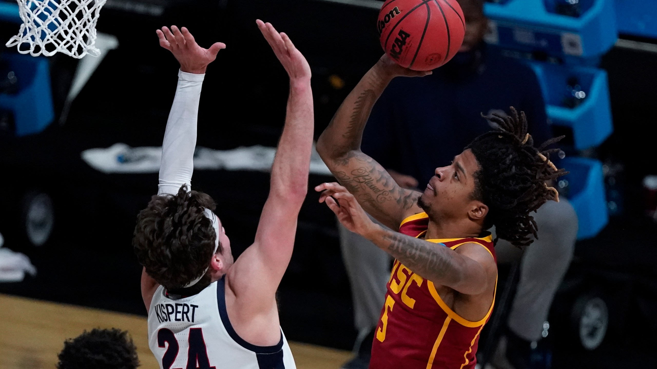 Southern California guard Isaiah White (5) shoots over Gonzaga forward Corey Kispert (24) during the first half of an Elite 8 game in the NCAA men's college basketball tournament at Lucas Oil Stadium in Indianapolis on March 30, 2021. (Michael Conroy / Associated Press)