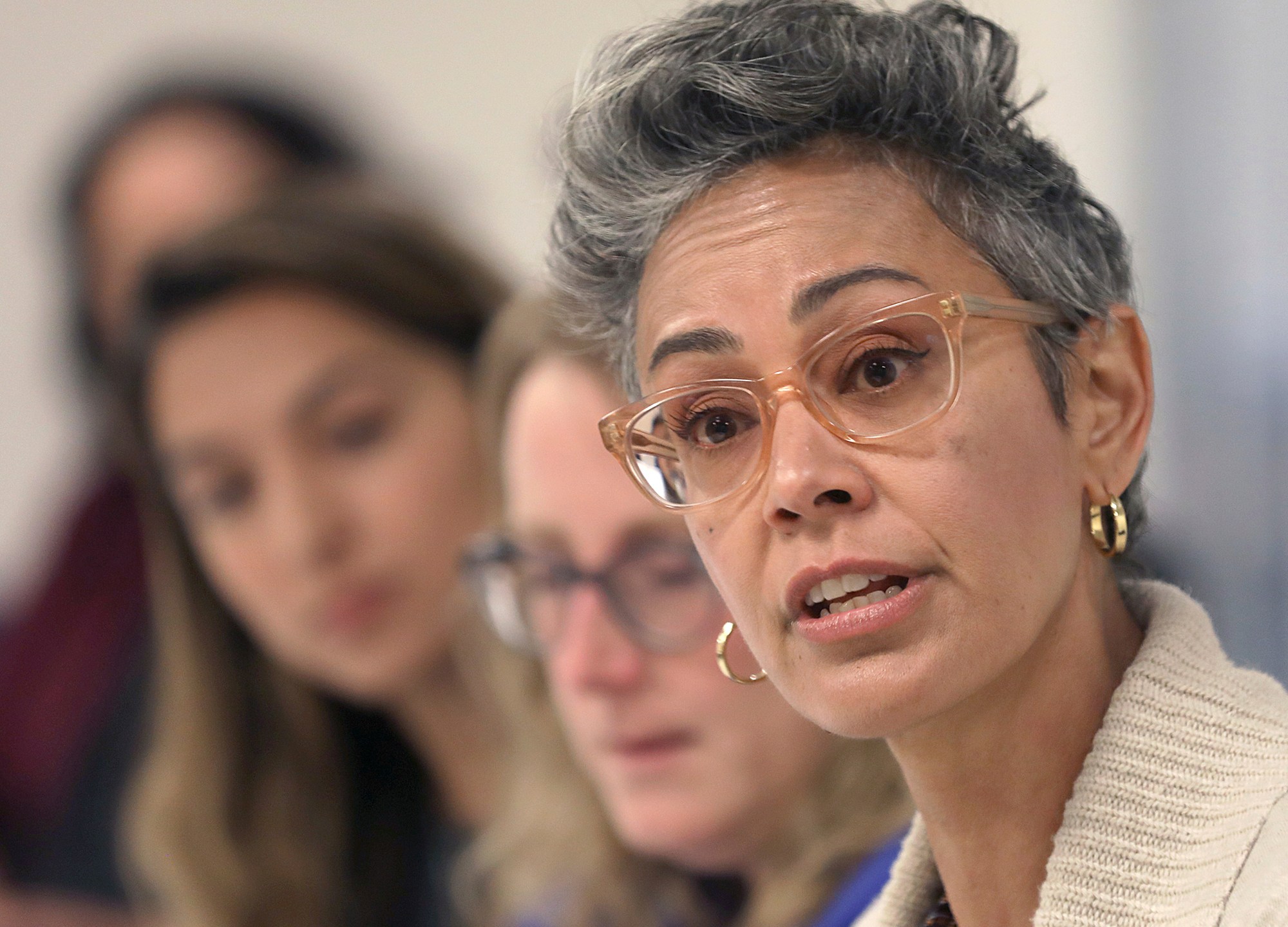 In this Sept. 26, 2018 file photo, Alison Collins, right, is seen during an editorial board meeting in San Francisco. (Liz Hafalia/San Francisco Chronicle via AP, File)