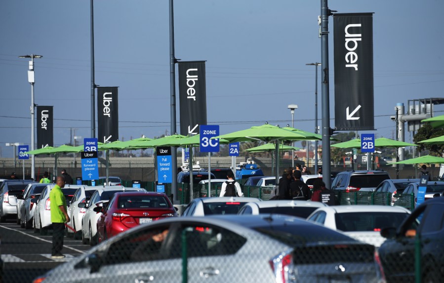 Uber vehicles are lined up at the 'LAX-it' ride-hail passenger pickup lot at Los Angeles International Airport on Nov. 6, 2019 in Los Angeles. (Mario Tama/Getty Images)