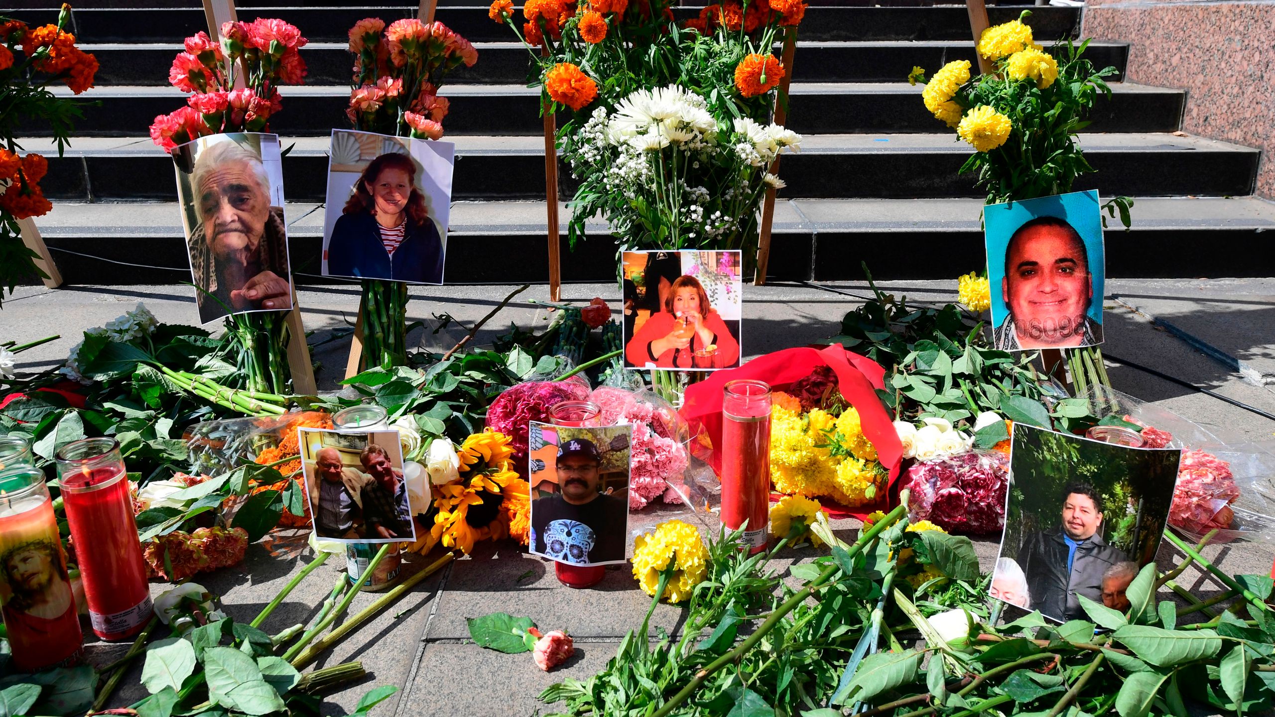 Flowers, candles and photographs are placed at a memorial honouring more than 5,700 residents of Los Angeles who lost their lives to coronavirus on August 31, 2020 in Los Angeles, California. (Frederic J. Brown/AFP via Getty Images)