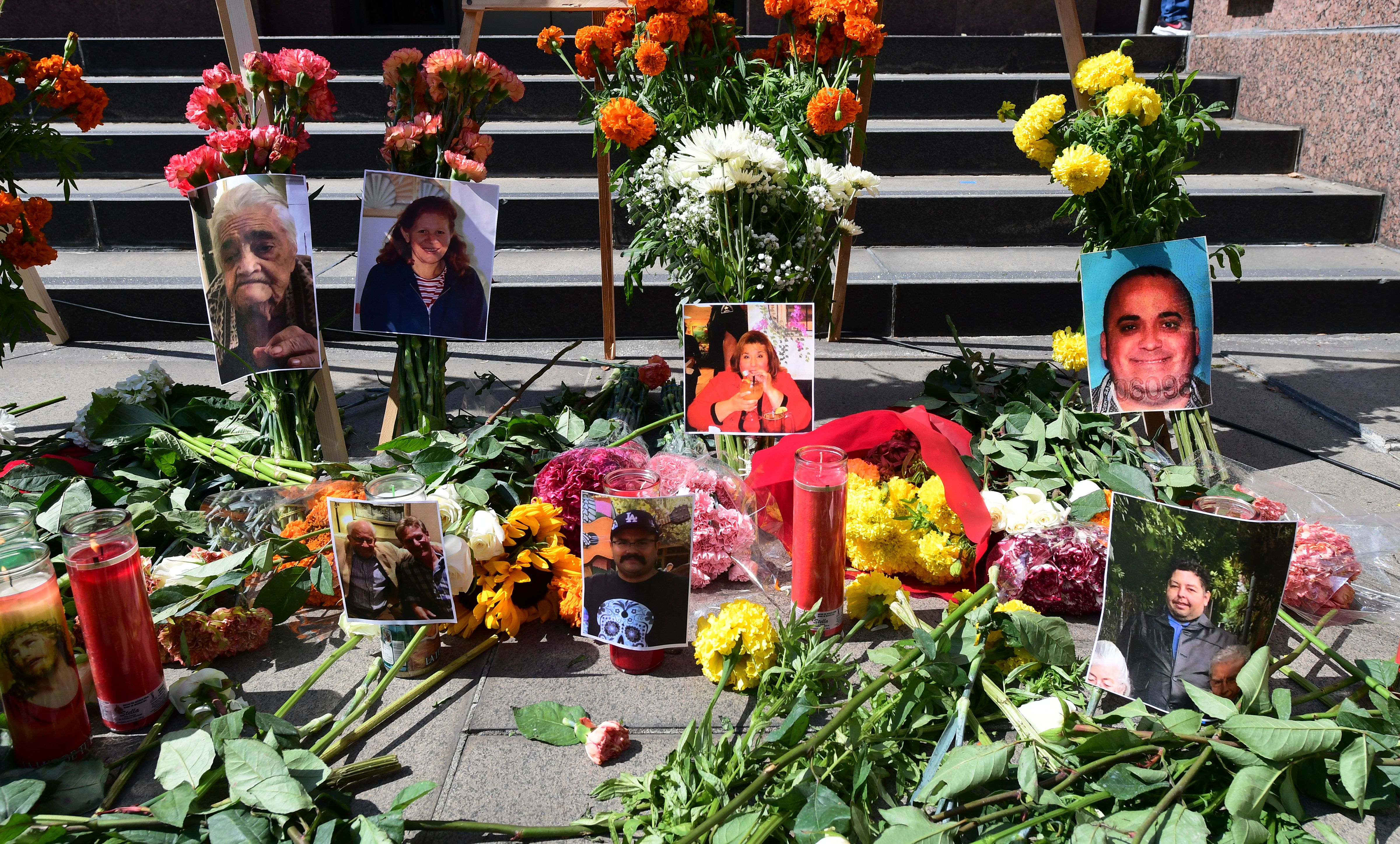 Flowers, candles and photographs are placed at a memorial honouring more than 5,700 residents of Los Angeles who lost their lives to coronavirus on August 31, 2020 in Los Angeles, California. (Frederic J. Brown/AFP via Getty Images)