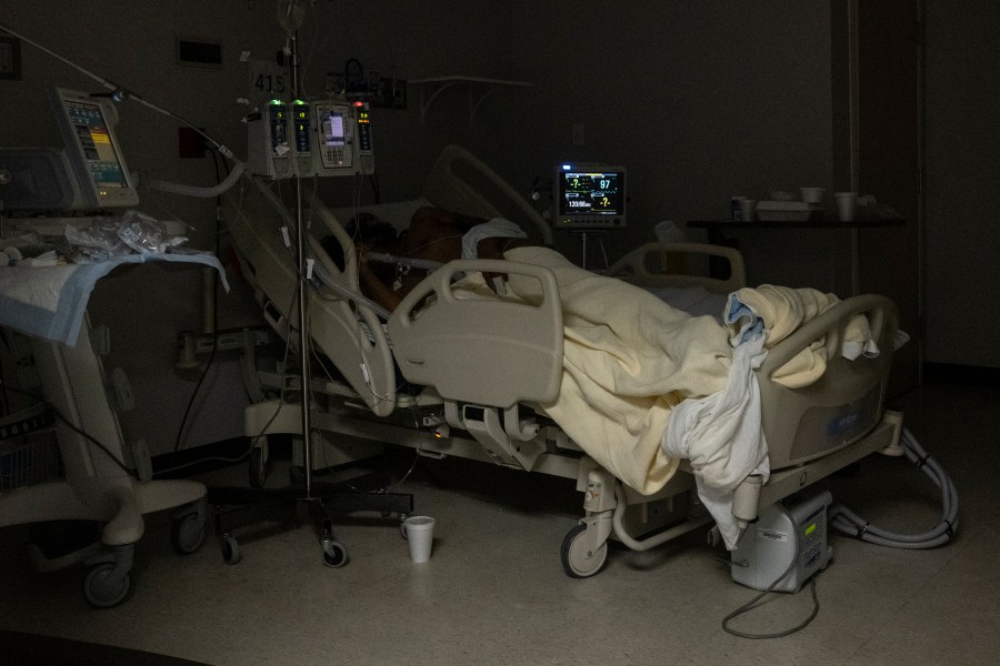 A patient is seen lying on a bed in the COVID-19 intensive care unit (ICU) on New Year's Eve at the United Memorial Medical Center on December 31, 2020 in Houston, Texas. (Photo by Go Nakamura/Getty Images)