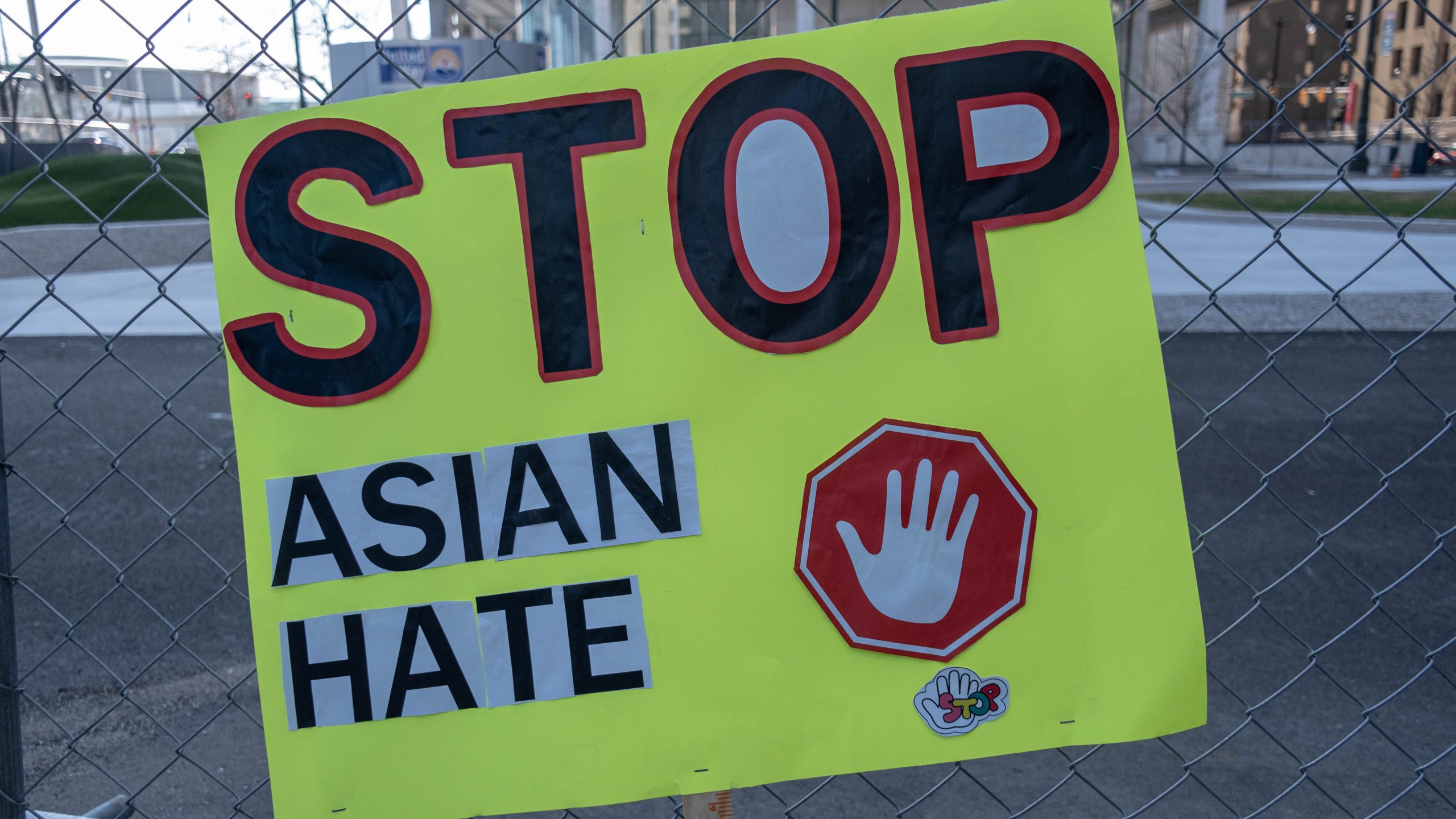 A sign is seen on a fence after a Stop Asian Hate rally in downtown Detroit, Michigan on March 27,2021, as part of a nation wide protest in solidarity against hate crimes directed towards Asian Americans in the wake of the Atlanta, Georgia spa shootings that left eight dead. (Seth Herald/AFP via Getty Images)