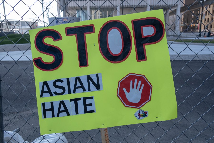 A sign is seen on a fence after a Stop Asian Hate rally in downtown Detroit, Michigan on March 27,2021, as part of a nation wide protest in solidarity against hate crimes directed towards Asian Americans in the wake of the Atlanta, Georgia spa shootings that left eight dead. (Seth Herald/AFP via Getty Images)