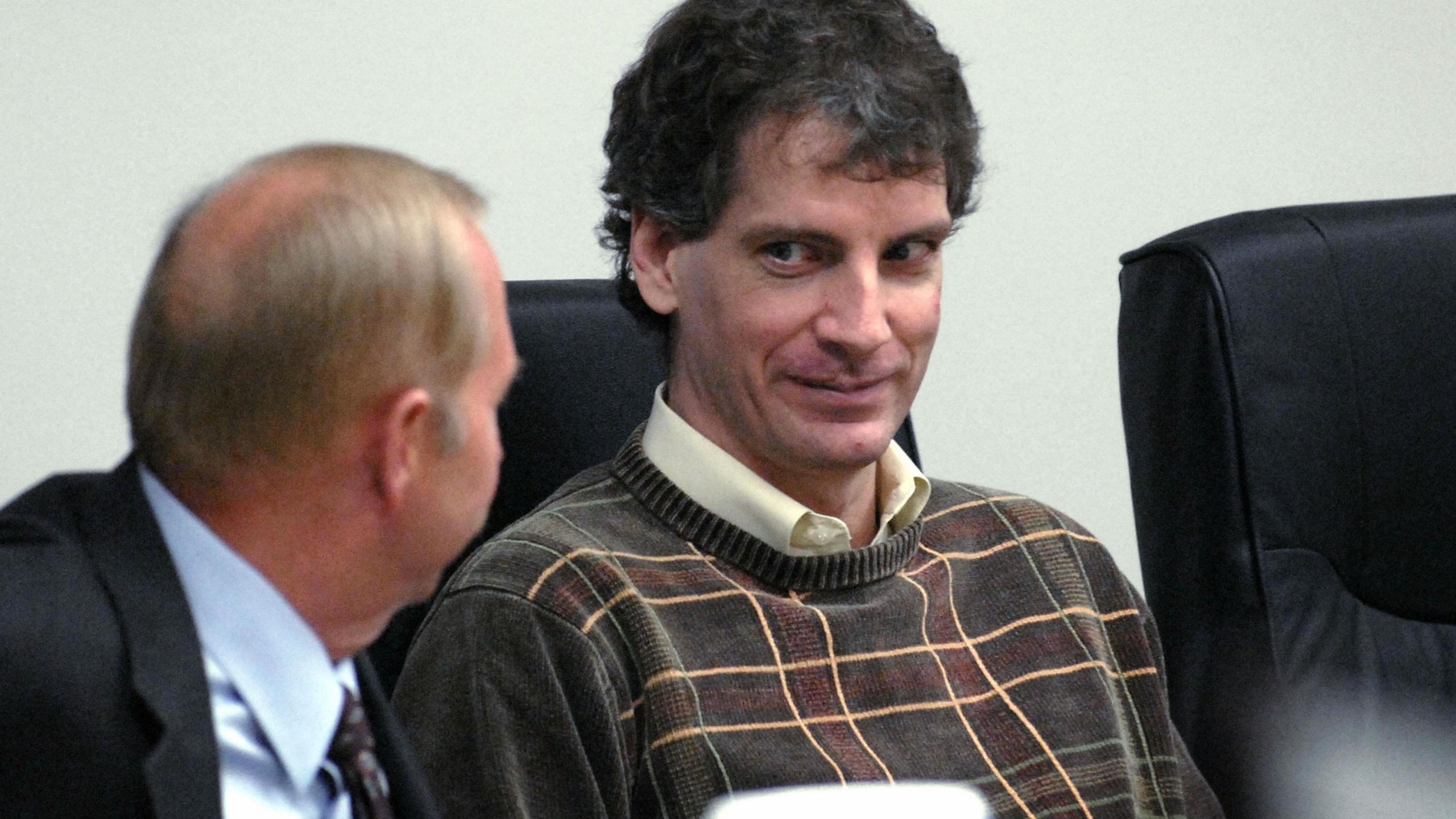 Joseph Edward Duncan III (R), listens to his Public Defender John Adams (L), during a plea agreement and sentencing hearing in the court room of the Kootenai County Jail 16 October, 2006 in Coeur d' Alene, Idaho. Duncan plead guilty to the murder and kidnapping of Mark McKenzie, Brenda Groene, and Slade Groene at their home near Coeur d' Alane in May 2005. Duncan was sentenced to three consecutive life sentences, without parole, on the kidnapping charges and still faces the death penality pending charges of murder and kidnapping in a federal case that involves Dylan and Shasta Groene. (KATHY PLONKA/AFP via Getty Images)