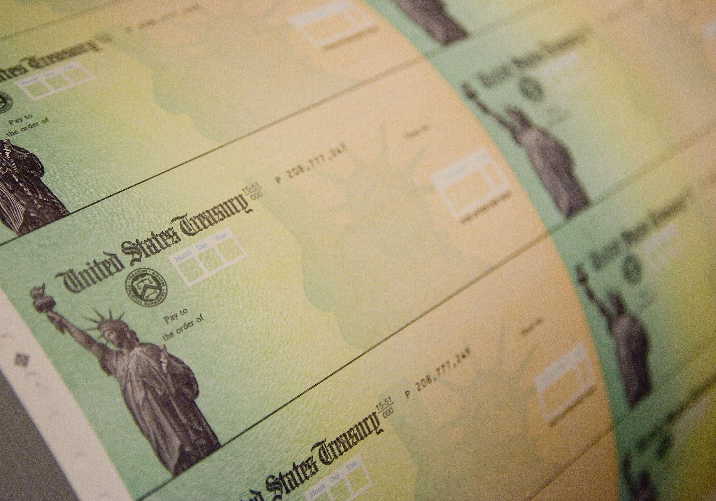 Economic stimulus checks are prepared for printing at the Philadelphia Financial Center May 8, 2008 in Philadelphia, Pennsylvania. (Jeff Fusco/Getty Images)