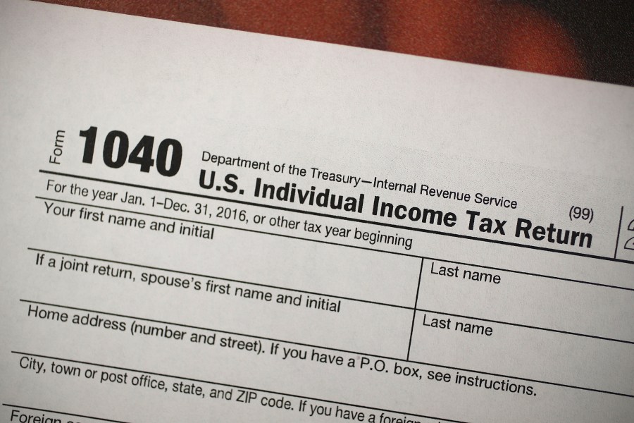 In this file photo, a copy of a IRS 1040 tax form is seen at an H&R Block office on December 22, 2017 in Miami, Florida. (Joe Raedle/Getty Images)