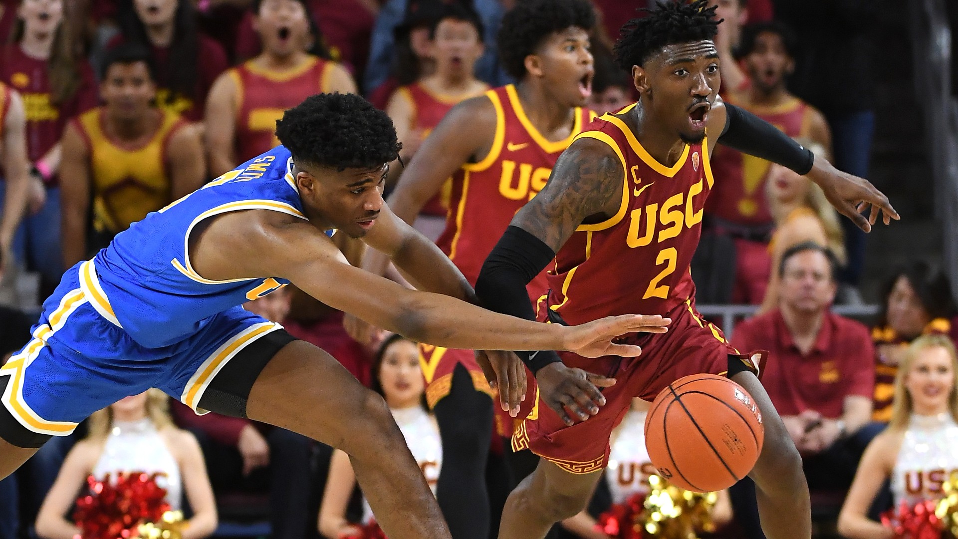 Chris Smith #5 of the UCLA Bruins and Jonah Mathews #2 of the USC Trojans battle for a loose ball in the second half of the game at Galen Center on March 7, 2020 in Los Angeles. (Jayne Kamin-Oncea/Getty Images)