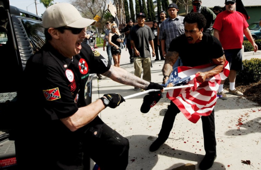 People clash during a 2016 Ku Klux Klan protest in Anaheim left three people with stab wounds. (Luis Sinco / Los Angeles Times)