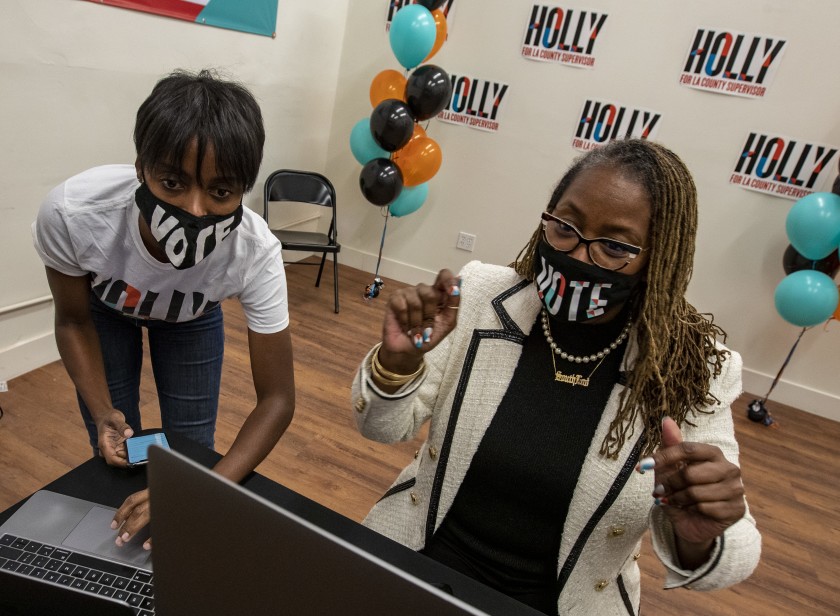 Holly Mitchell, right, and campaign manager Lenee Richards watched for election updates Nov. 3, 2020, during Mitchell’s successful race against Herb Wesson for a seat on the Los Angeles County Board of Supervisors. (Brian van der Brug / Los Angeles Times)