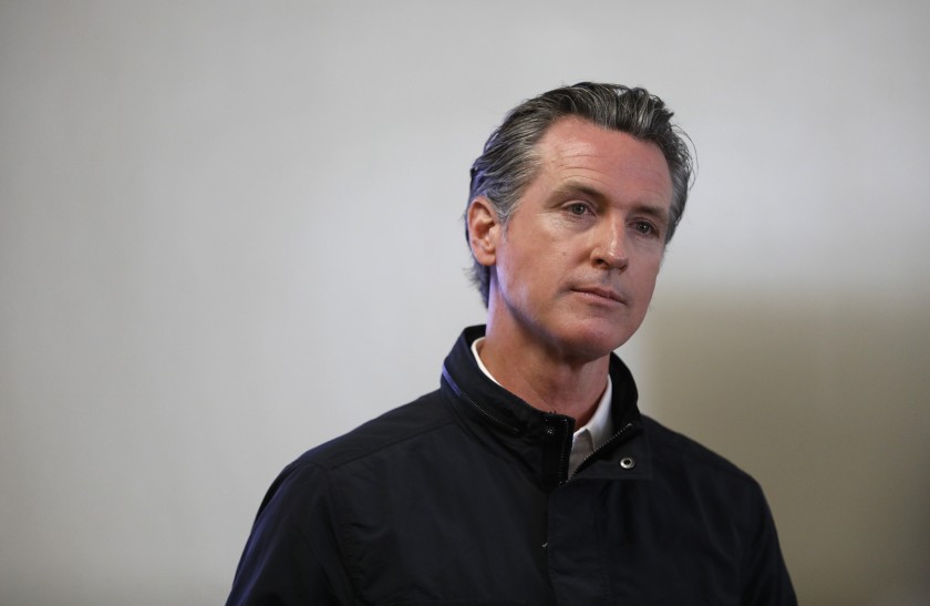 Gov. Gavin Newsom visits a vaccination site at South Gate Park in Los Angeles County on March 10, 2021. (Al Seib / Los Angeles Times)