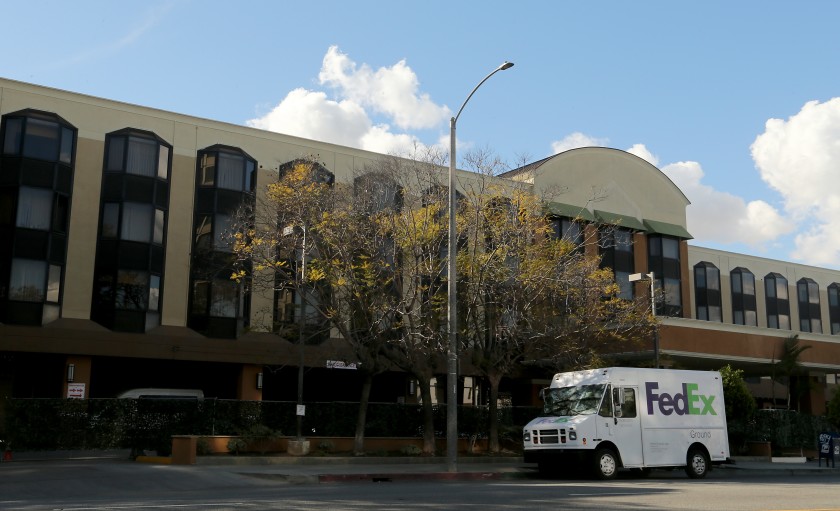 A former Holiday Inn hotel in Long Beach, purchased by Los Angeles County in December to house homeless adults, was temporarily used to quarantine people with COVID-19. (Luis Sinco / Los Angeles Times)