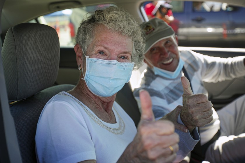 Hulene Dykstra and her husband Heinz Beer were in an upbeat mood after she got her first dose of the Moderna COVID-19 vaccine in San Bernardino County.(Irfan Khan / Los Angeles Times)