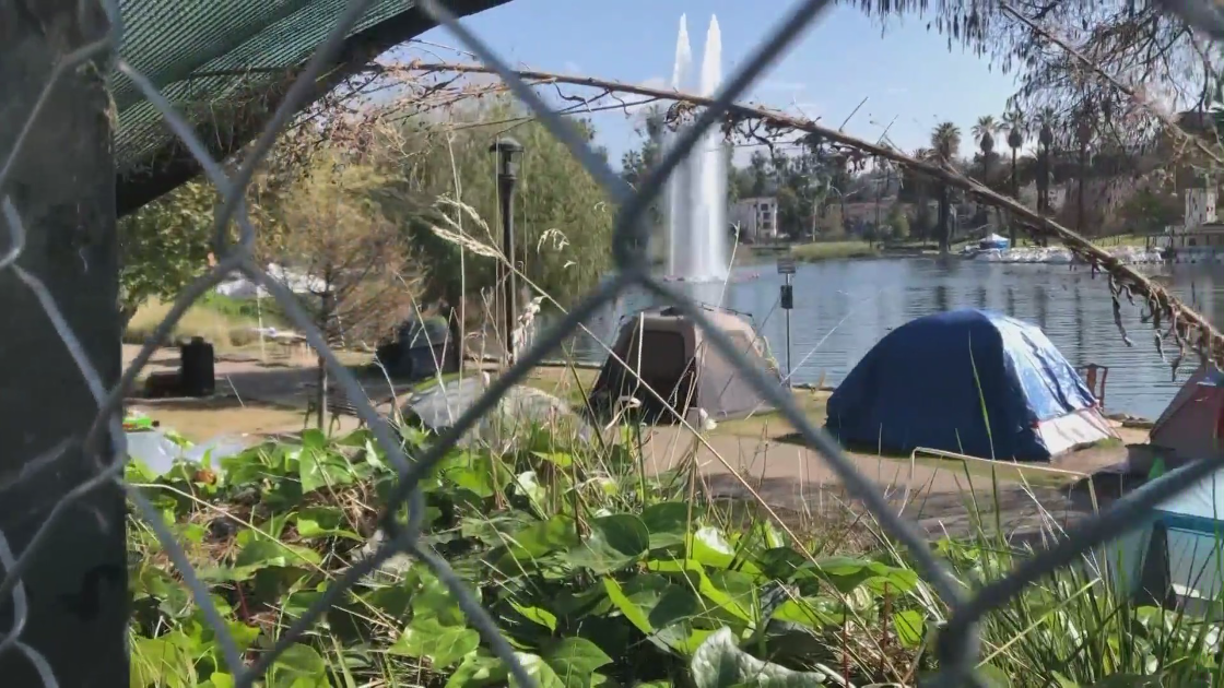 Fencing surrounds Echo Park Lake amid an ongoing cleanup effort of homeless encampments march 30, 2021. (KTLA)