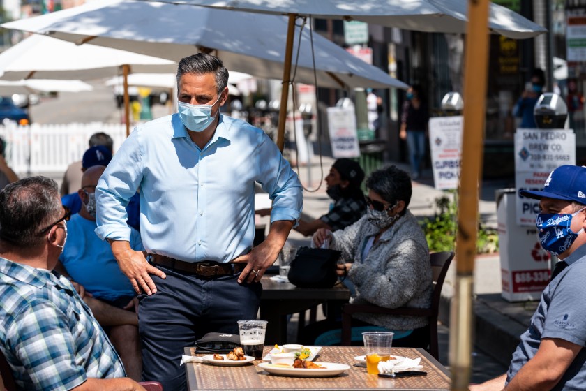 Councilman Joe Buscaino speaks with people dining in San Pedro in May. Buscaino will kick off his campaign for Los Angeles mayor on Monday.(Kent Nishimura / Los Angeles Times)