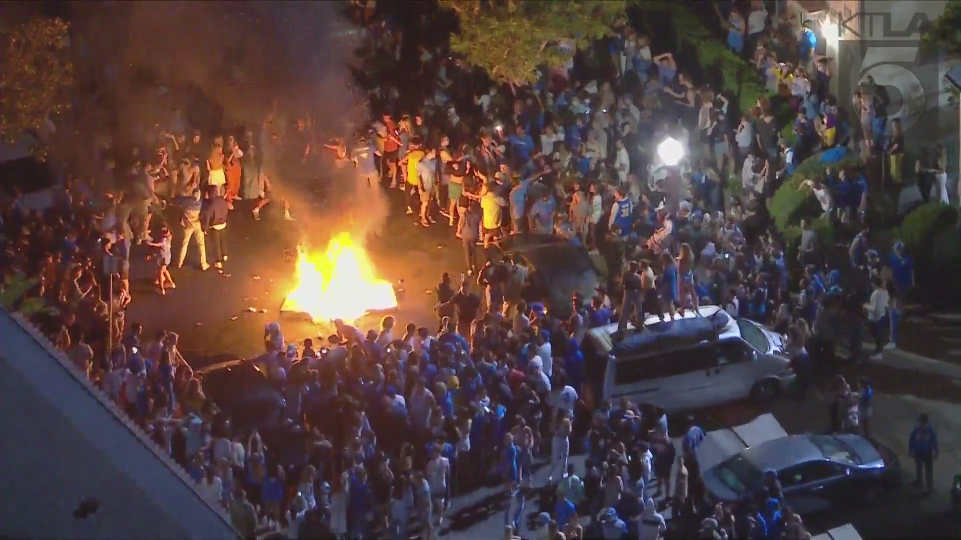 Bruin fans light fires in the streets of Westwood after UCLA advanced to the NCAA Tournament Final Four with a 51-49 win over No. 1 seed Michigan on March 30, 2021. (KTLA)