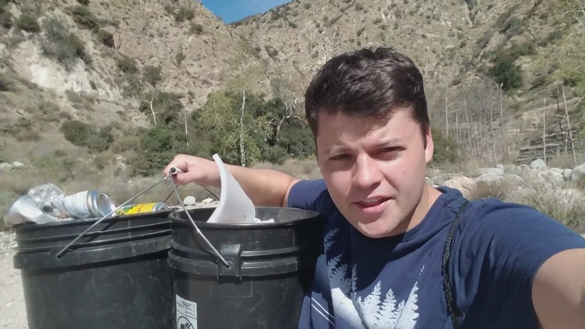 Edgar Mcgregor is seen cleaning up Eaton Canyon Park in this undated video.