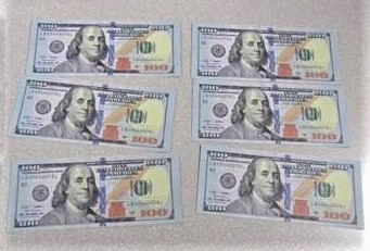 Fake $100 bills are seen in a photo released by CBP on March 22, 2021. 