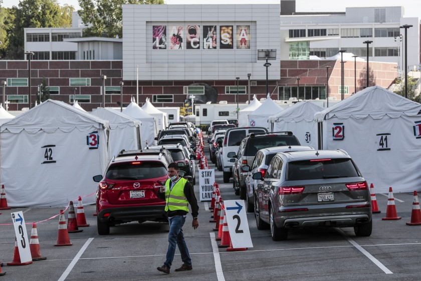 Drivers line up for COVID-19 vaccines at Cal State L.A. in an undated photo. (Robert Gauthier / Los Angeles Times)