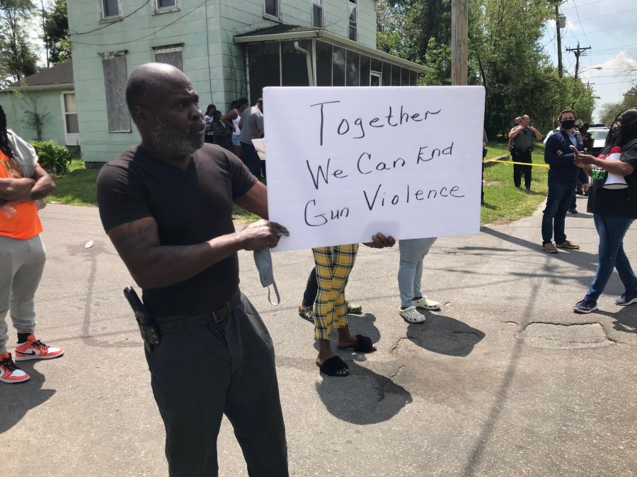 A demonstrator holds up a sign while protesting the shooting of a man by a sheriff's deputy in Elizabeth City, North Carolina, on April 21, 2021. (WAVY)