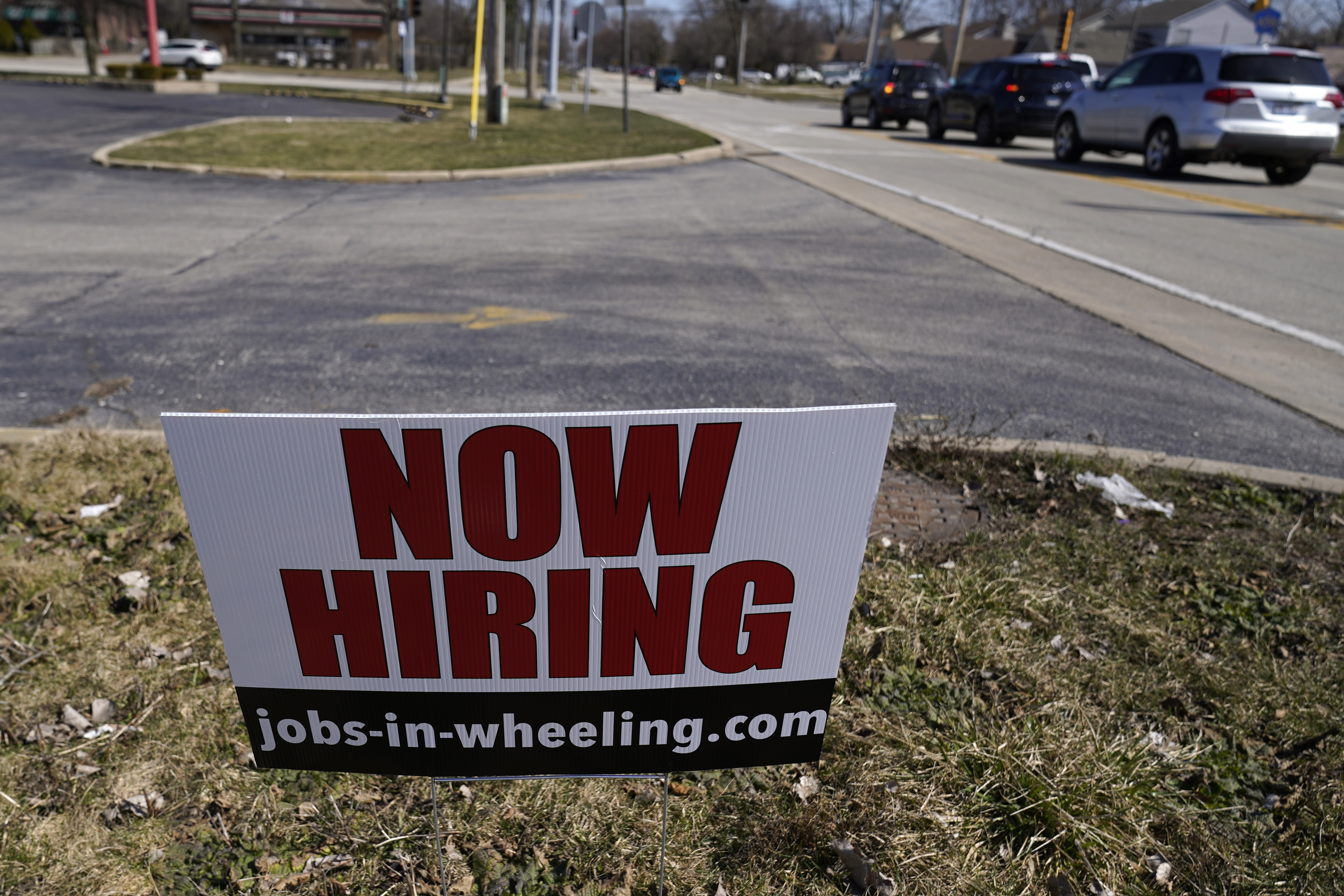 A hiring sign shows in Wheeling, Ill., Sunday, March 21, 2021. The number of Americans applying for unemployment aid fell last week to 547,000, a new low since the pandemic struck and a further encouraging sign that layoffs are slowing on the strength of an improving job market. The Labor Department said Thursday, April 22, that applications declined 39,000 from a revised 586,000 a week earlier. (AP Photo/Nam Y. Huh)