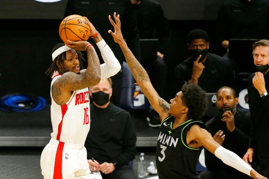 Houston Rockets guard Ben McLemore (16) shoots against Minnesota Timberwolves forward Jaden McDaniels (3) in the fourth quarter during an NBA basketball game, Friday, March 26, 2021, in Minneapolis. (AP Photo/Andy Clayton-King)