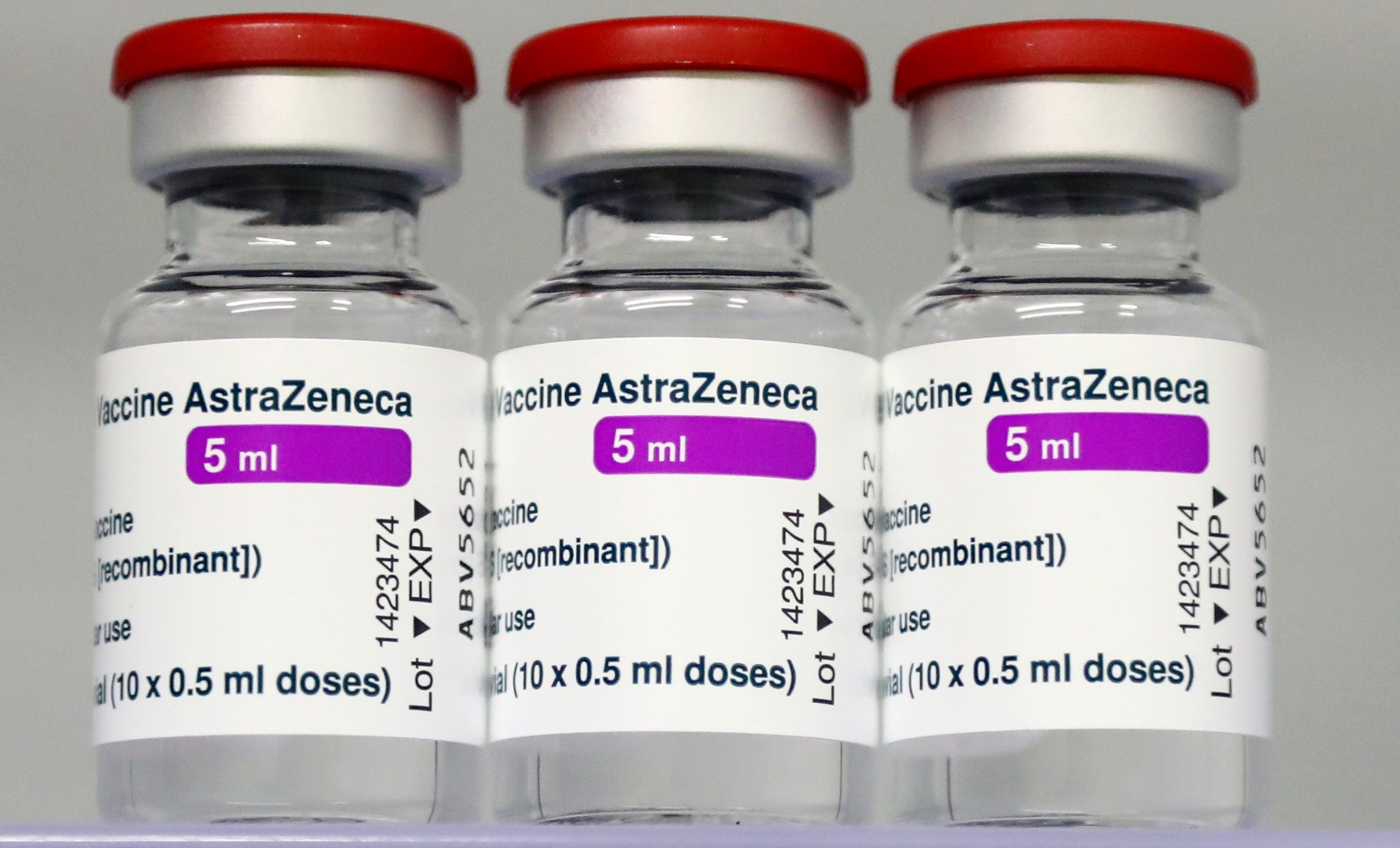 In this file photo dated Monday, March 22, 2021, vials of the AstraZeneca COVID-19 vaccine in a fridge at the local vaccine center in Ebersberg near Munich, Germany. German officials have decided to limit the use of AstraZeneca’s coronavirus vaccine in people under 60 after more unusual blood clots were reported in a small number of people who received the shots. Earlier this month, more than a dozen countries, including Germany, suspended their use of AstraZeneca over the blood clot issue. (AP Photo/Matthias Schrader, File)