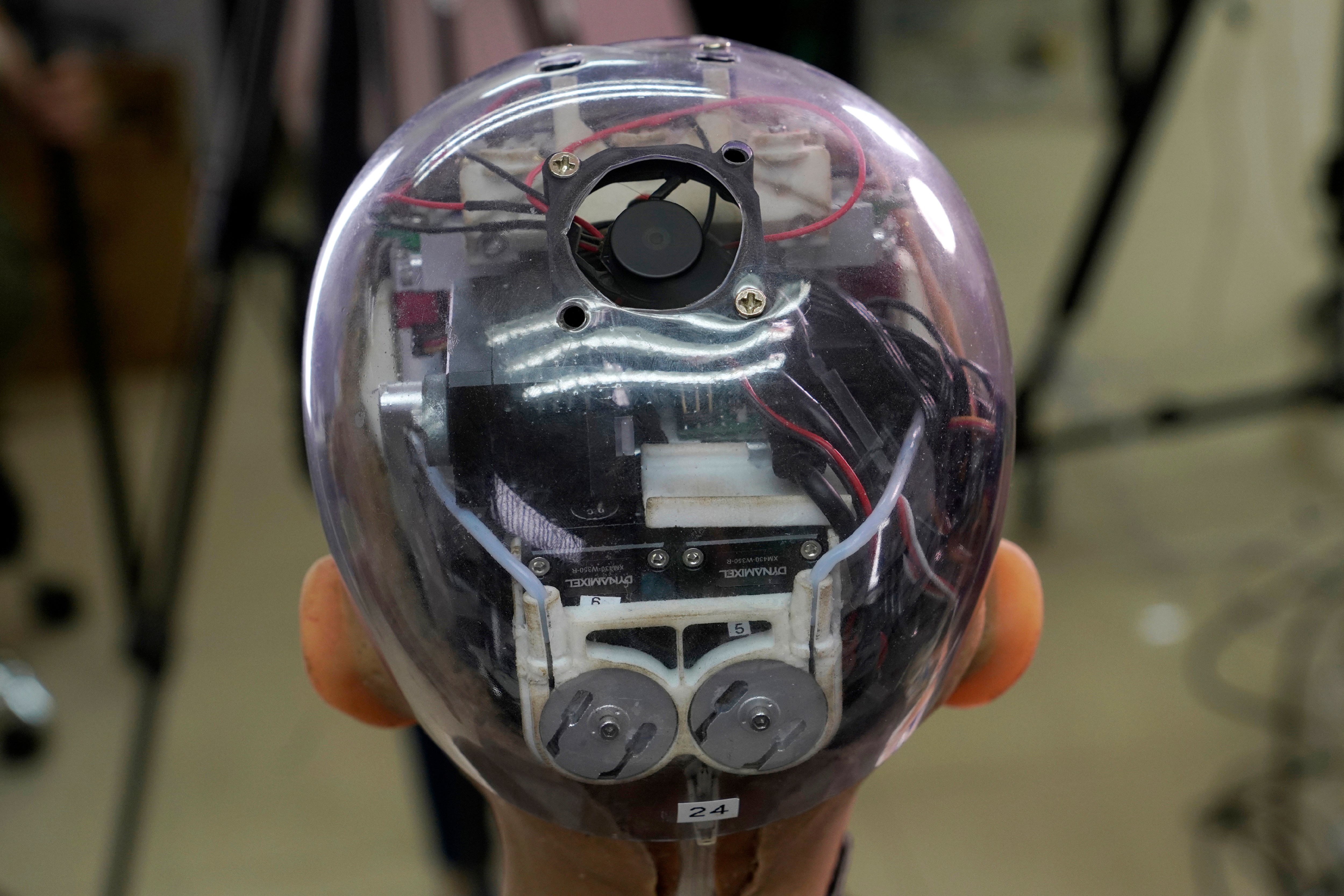 The head of Sophia shows the inside content visually through the transparent skull at Hanson Robotics studio in Hong Kong on March 29, 2021. (AP Photo/Vincent Yu)