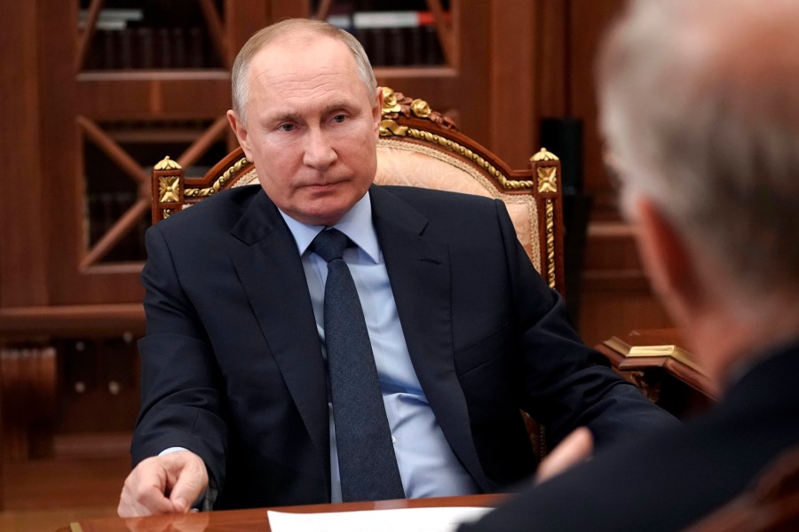 Russian President Vladimir Putin listens to General Director of the Russian Direct Investment Fund Krill Dmitriev at the Kremlin in Moscow, Russia, Friday, April 2, 2021. (Alexei Druzhinin, Sputnik, Kremlin Pool Photo via AP)