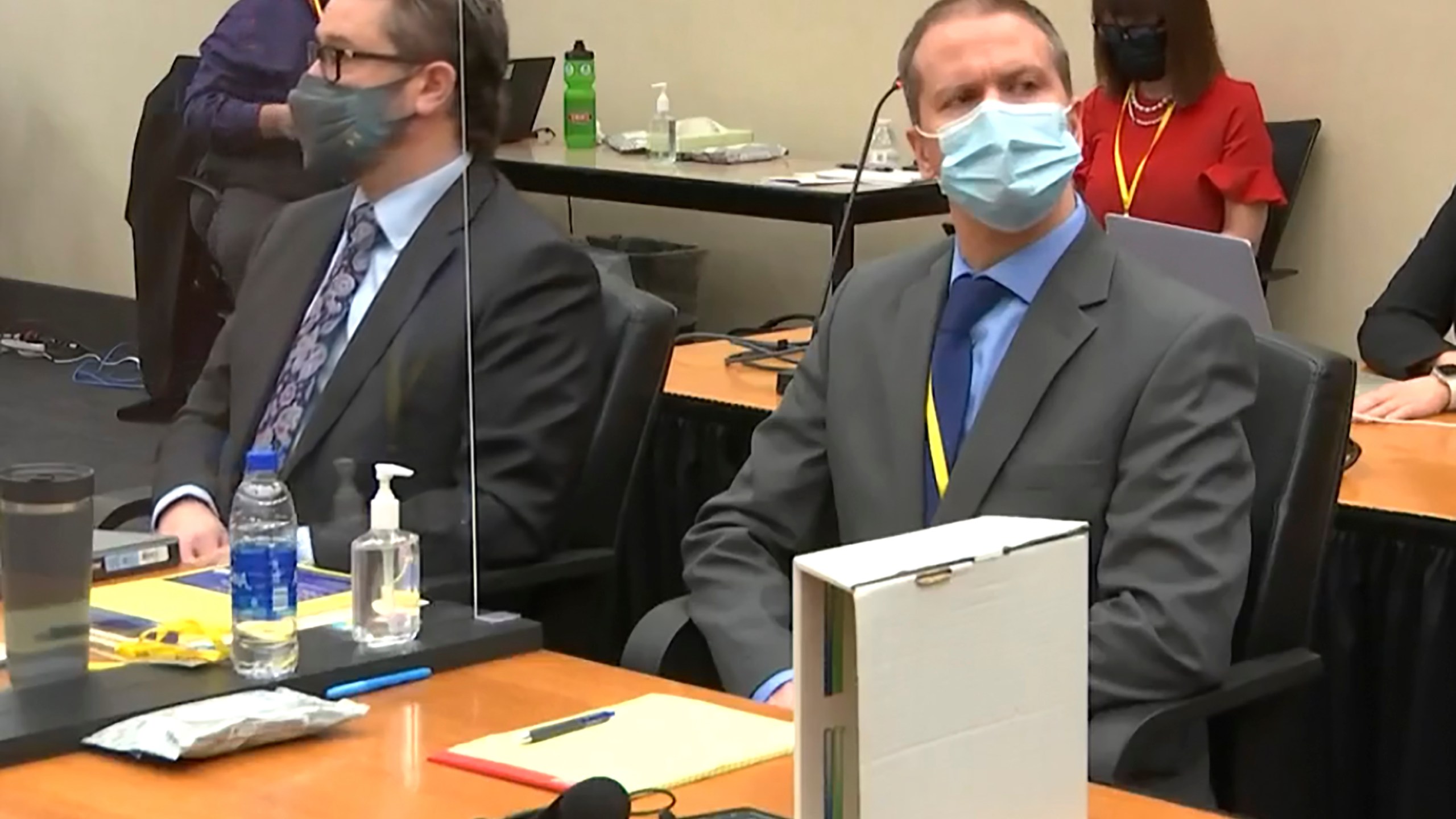 In this March 29, 2021 file image from video, defense attorney Eric Nelson, left, and former Minneapolis police officer Derek Chauvin listen as Hennepin County Judge Peter Cahill presides over pre-trial motions prior to opening statements in the trial of Chauvin for the May 25, 2020, death of George Floyd at the Hennepin County Courthouse in Minneapolis, Minn. (Court TV via AP, Pool, File)