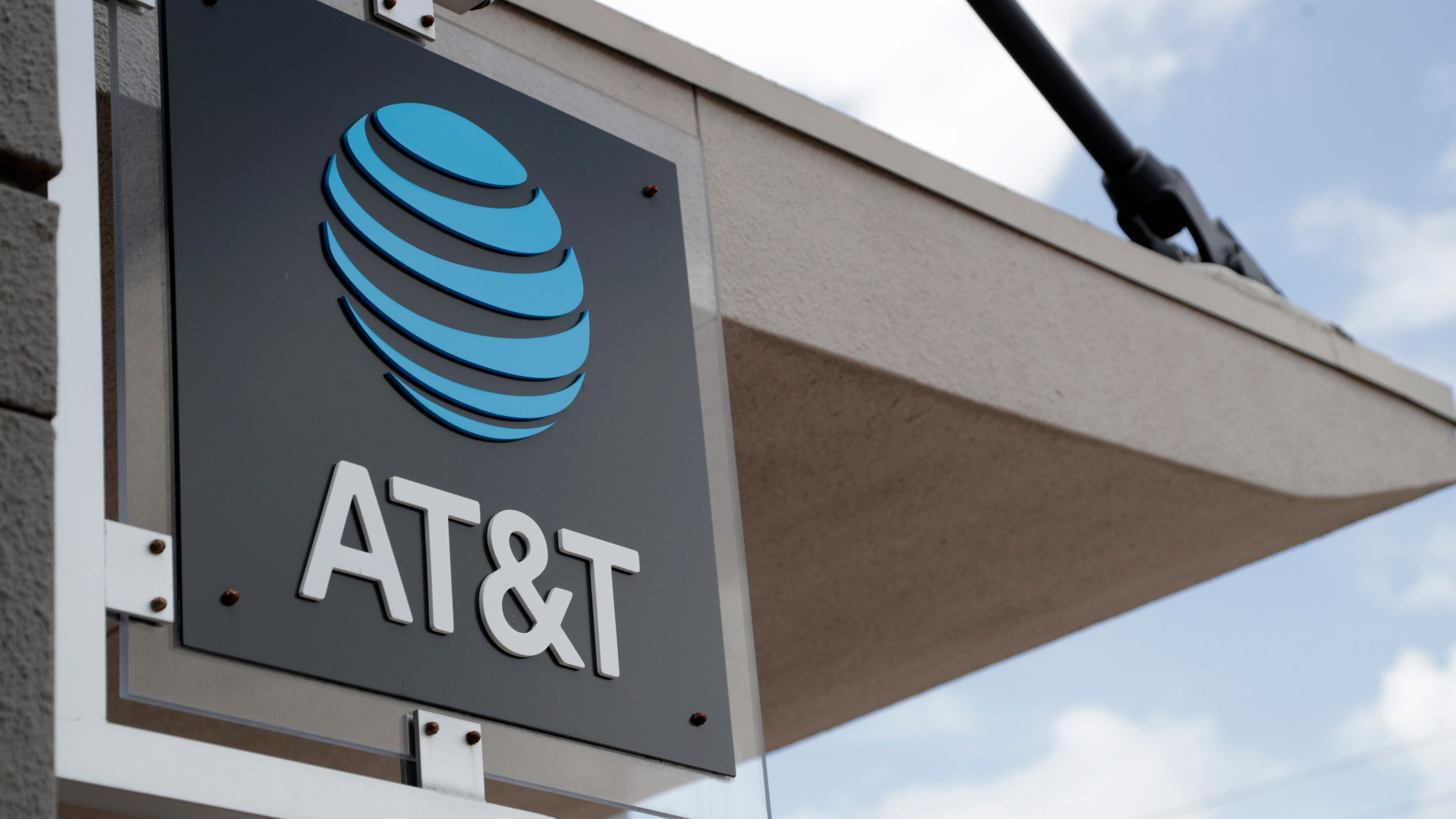 In this July 18, 2019, file photo, a sign is displayed at an AT&T retail store in Miami. (AP Photo/Lynne Sladky, File)