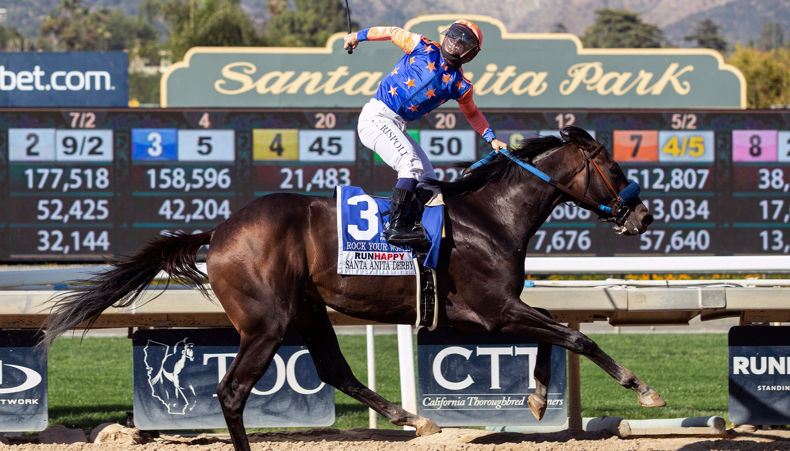 In a photo provided by Benoit Photo, Rock Your World and jockey Umberto Rispoli win the Grade I $750,000 Santa Anita Derby Saturday, April 3, 2021 at Santa Anita Park in Arcadia, Calif. (Benoit Photo via AP)