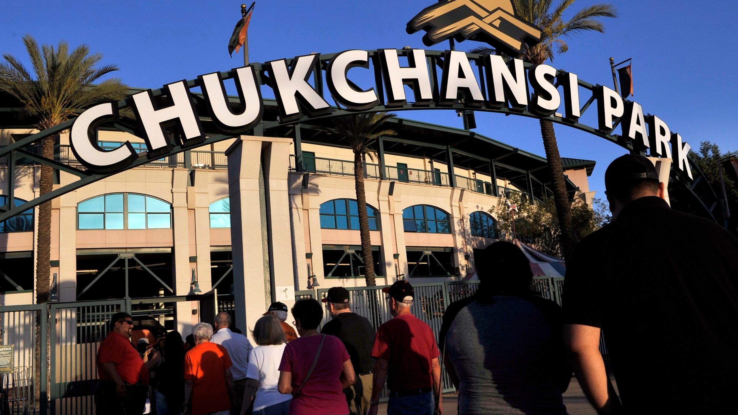 In this Sept. 18, 2015, file photo, fans arrive at Chukchansi Park in Fresno, Calif., for a minor-league baseball game between the Fresno Grizzlies and the Round Rock Express. (Eric Paul Zamora/The Fresno Bee via AP, File)