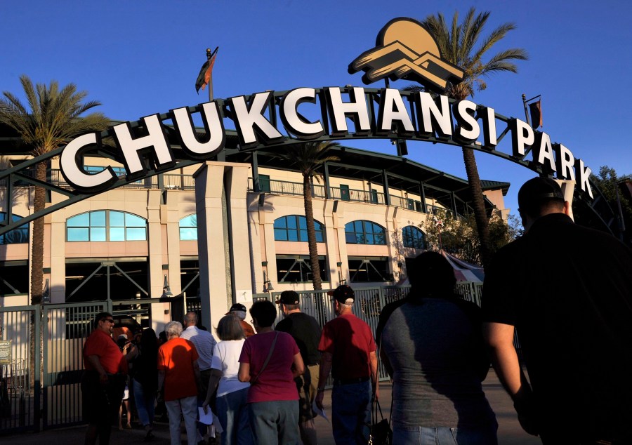 In this Sept. 18, 2015, file photo, fans arrive at Chukchansi Park in Fresno, Calif., for a minor-league baseball game between the Fresno Grizzlies and the Round Rock Express. (Eric Paul Zamora/The Fresno Bee via AP, File)