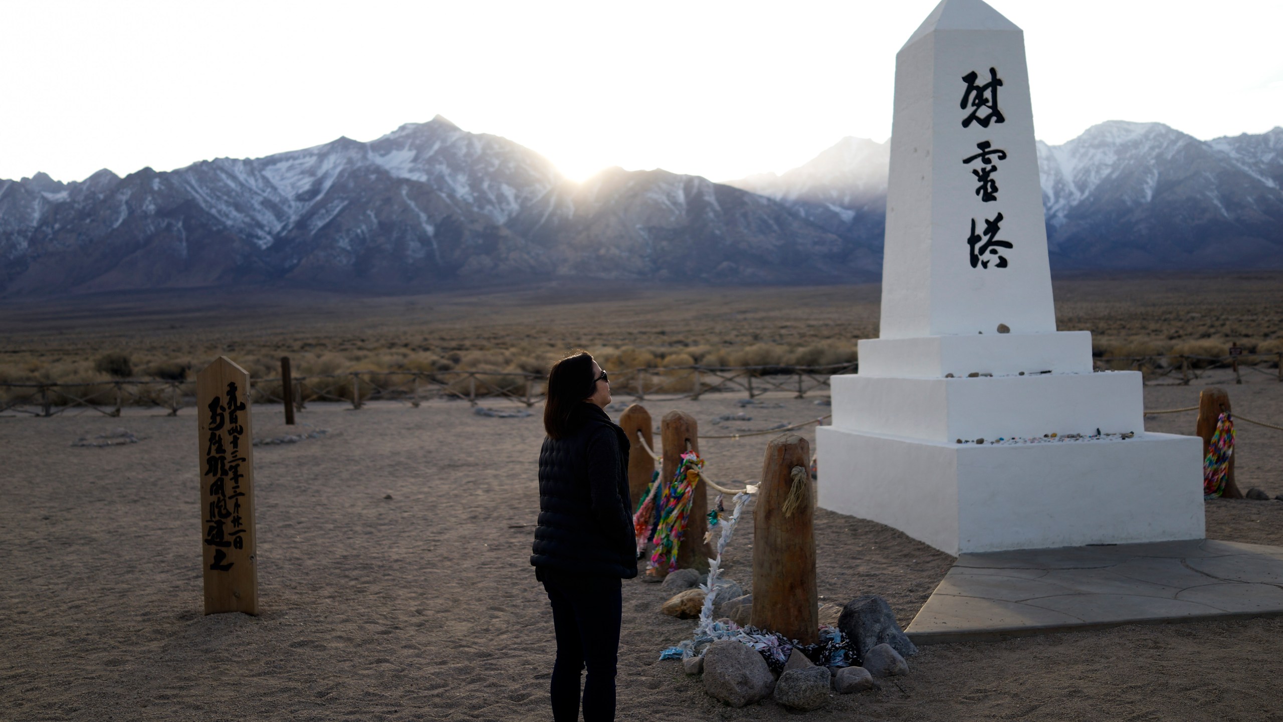 Lori Matsumura visits the cemetery at the Manzanar National Historic Site near Independence, Calif., on Feb. 17, 2020. (Brian Melley / Associated Press)