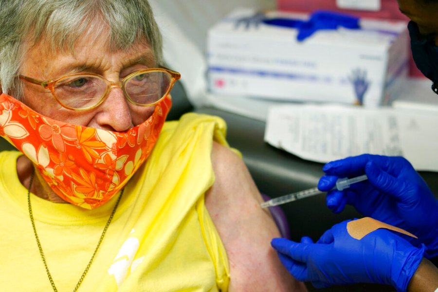 Linda Busby, 74, stiffens up as she receives the Johnson & Johnson COVID-19 vaccine at the Aaron E. Henry Community Health Service Center, Wednesday, April 7, 2021, in Clarksdale, Miss. (AP Photo/Rogelio V. Solis)