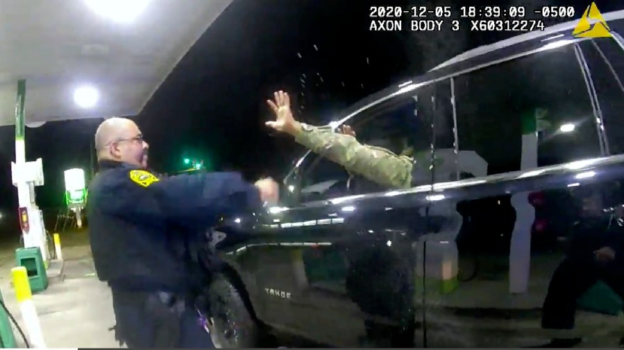 In this image made from Windsor, (Va.) Police video, A police officer uses a spray agent on Caron Nazario on Dec. 20, 2020, in Windsor, Va. (Windsor Police via AP)