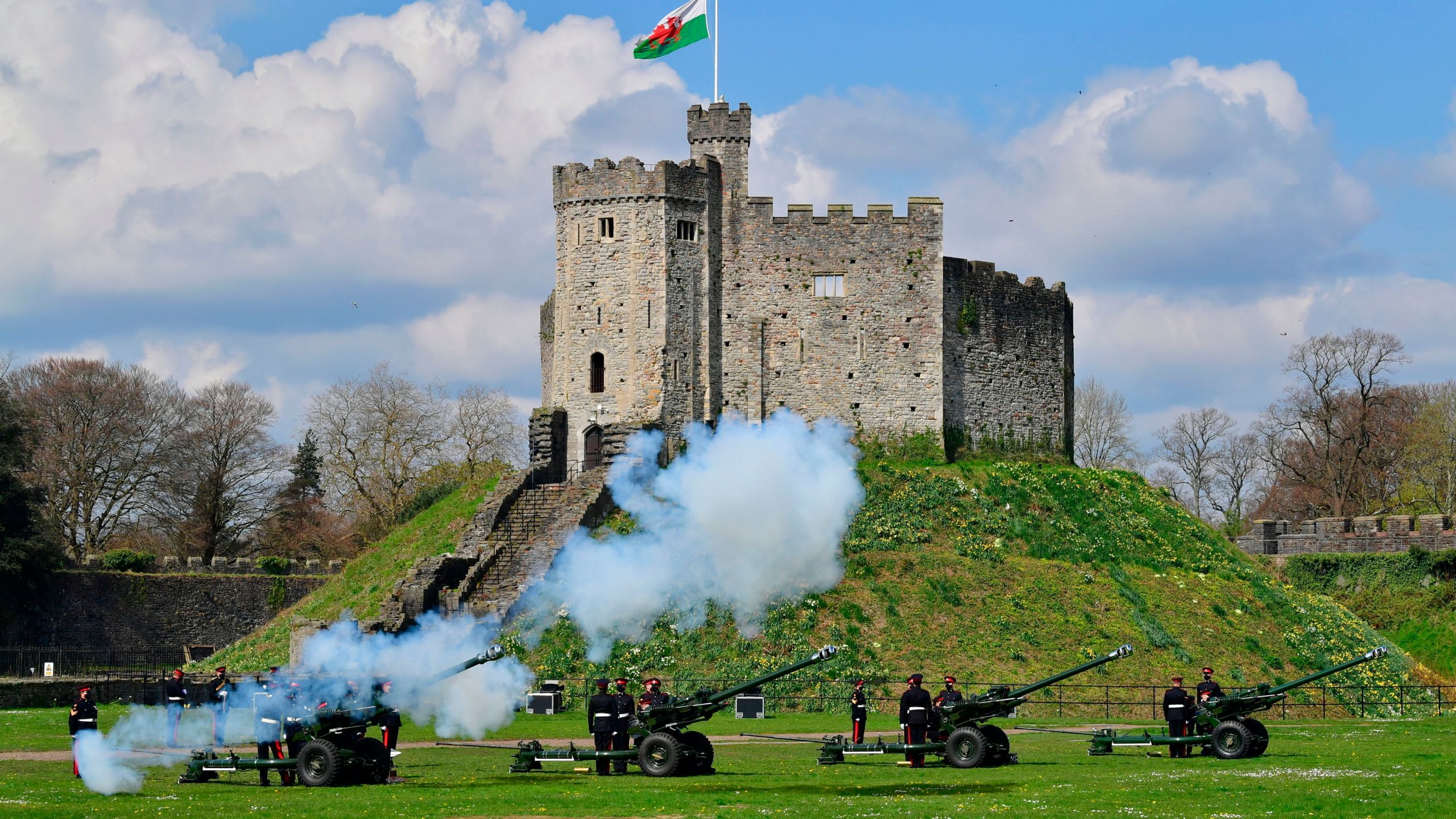 Members of the 104th Regiment Royal Artillery fire a 41-round gun salute in the grounds of Cardiff Castle, to mark the death of Prince Philip, in Cardiff, Saturday, April 10, 2021. (Ben Birchall/PA via AP)