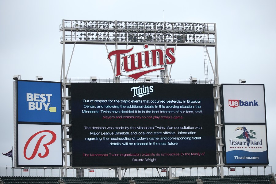 The scoreboard at Target Field explains the postponement of the baseball game between the Minnesota Twins and Boston Red Sox in Minneapolis on April 12, 2021. (Stacy Bengs / Associated Press)