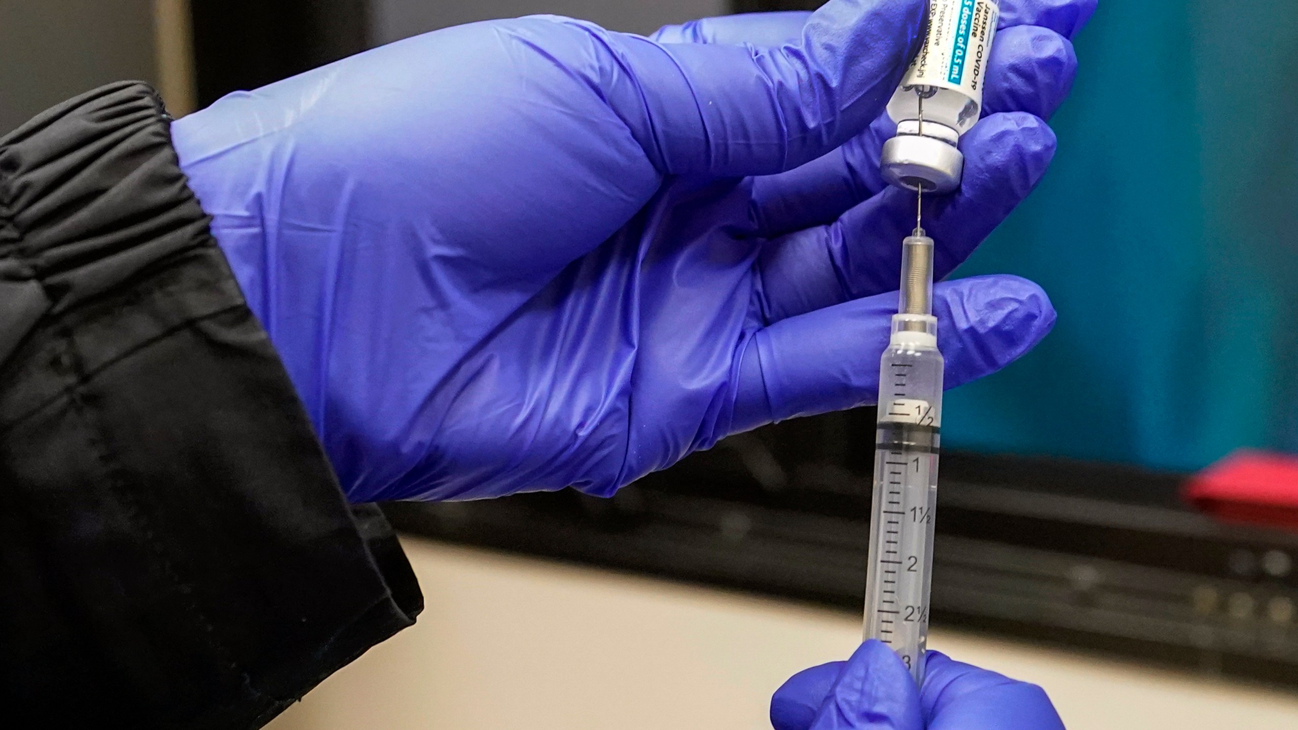 In this March 31, 2021, file photo, a nurse fills a syringe with Johnson & Johnson's one-dose COVID-19 vaccine at the Vaxmobile, at the Uniondale Hempstead Senior Center, in Uniondale, N.Y. U.S. health regulators on Tuesday, April 13, is recommending a “pause” in using the vaccine to investigate reports of potentially dangerous blood clots. (AP Photo/Mary Altaffer, File)