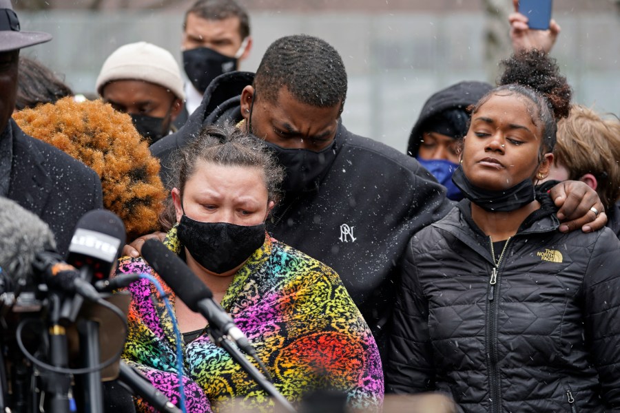 Katie Wright, left, the mother of Daunte Wright, and other family and friends gather during a news conference April 13, 2021, in Minneapolis as family attorney Ben Crump speaks. (AP Photo/Jim Mone)