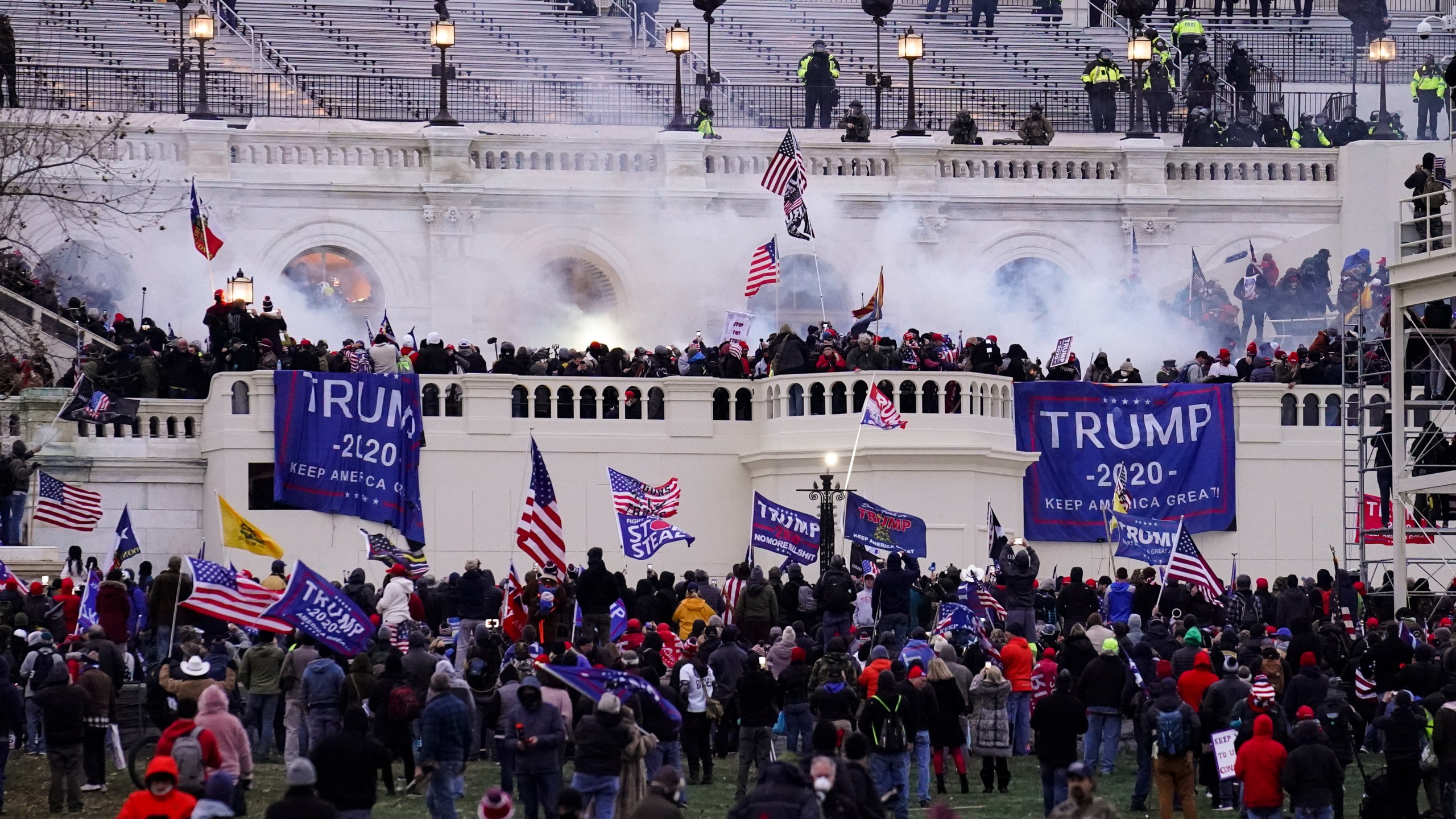 In this Jan. 6. 2021, file photo, people storm the Capitol in Washington. (John Minchillo/Associated Press)