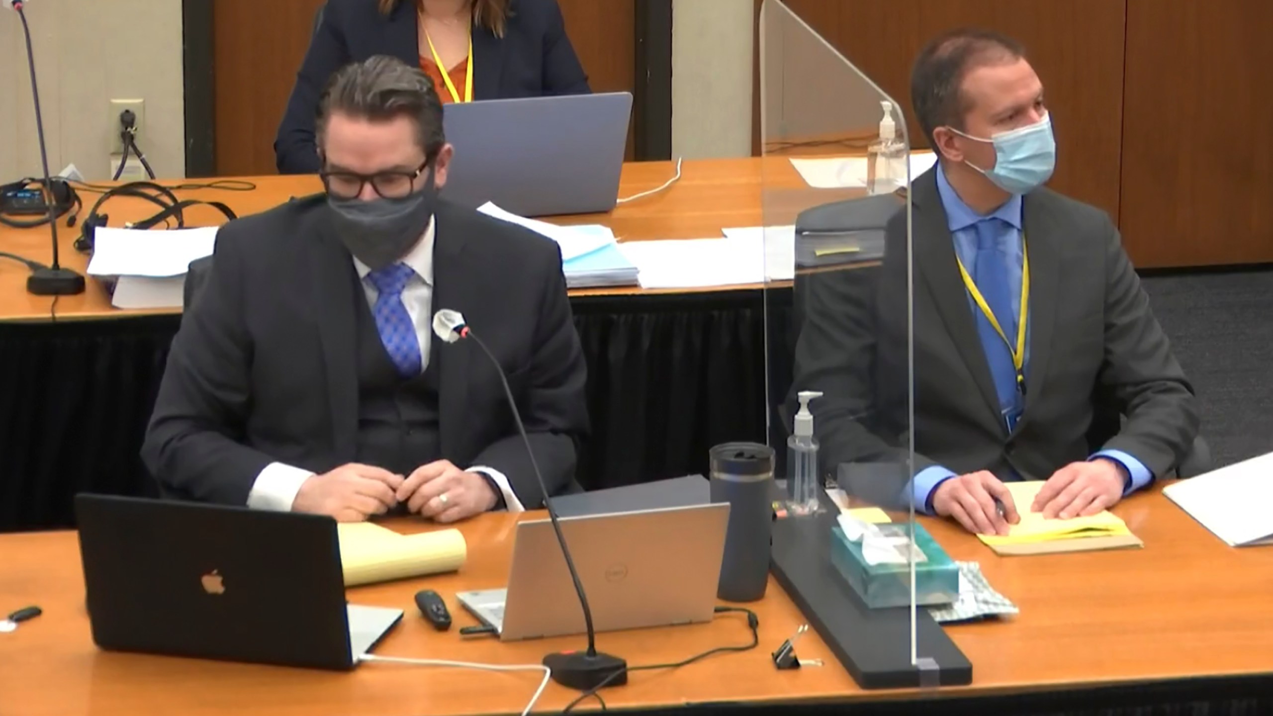 In this image from video, defense attorney Eric Nelson, left, defendant, former Minneapolis police officer Derek Chauvin, right, listen, Wednesday, April 14, 2021, as Hennepin County Judge Peter Cahill presides over motions in the trial of Chauvin at the Hennepin County Courthouse in Minneapolis. Chauvin is charged in the May 25, 2020 death of George Floyd. (Court TV, via AP, Pool)