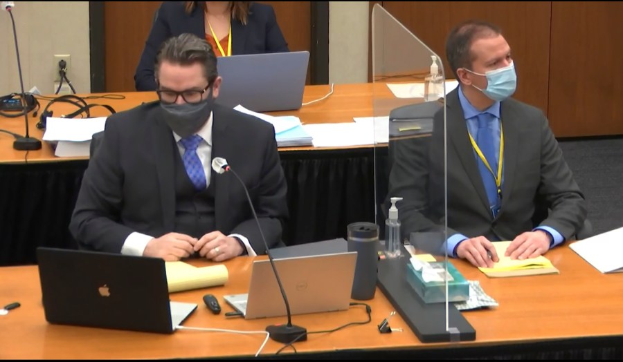 In this image from video, defense attorney Eric Nelson, left, defendant, former Minneapolis police officer Derek Chauvin, right, listen, Wednesday, April 14, 2021, as Hennepin County Judge Peter Cahill presides over motions in the trial of Chauvin at the Hennepin County Courthouse in Minneapolis. Chauvin is charged in the May 25, 2020 death of George Floyd. (Court TV, via AP, Pool)