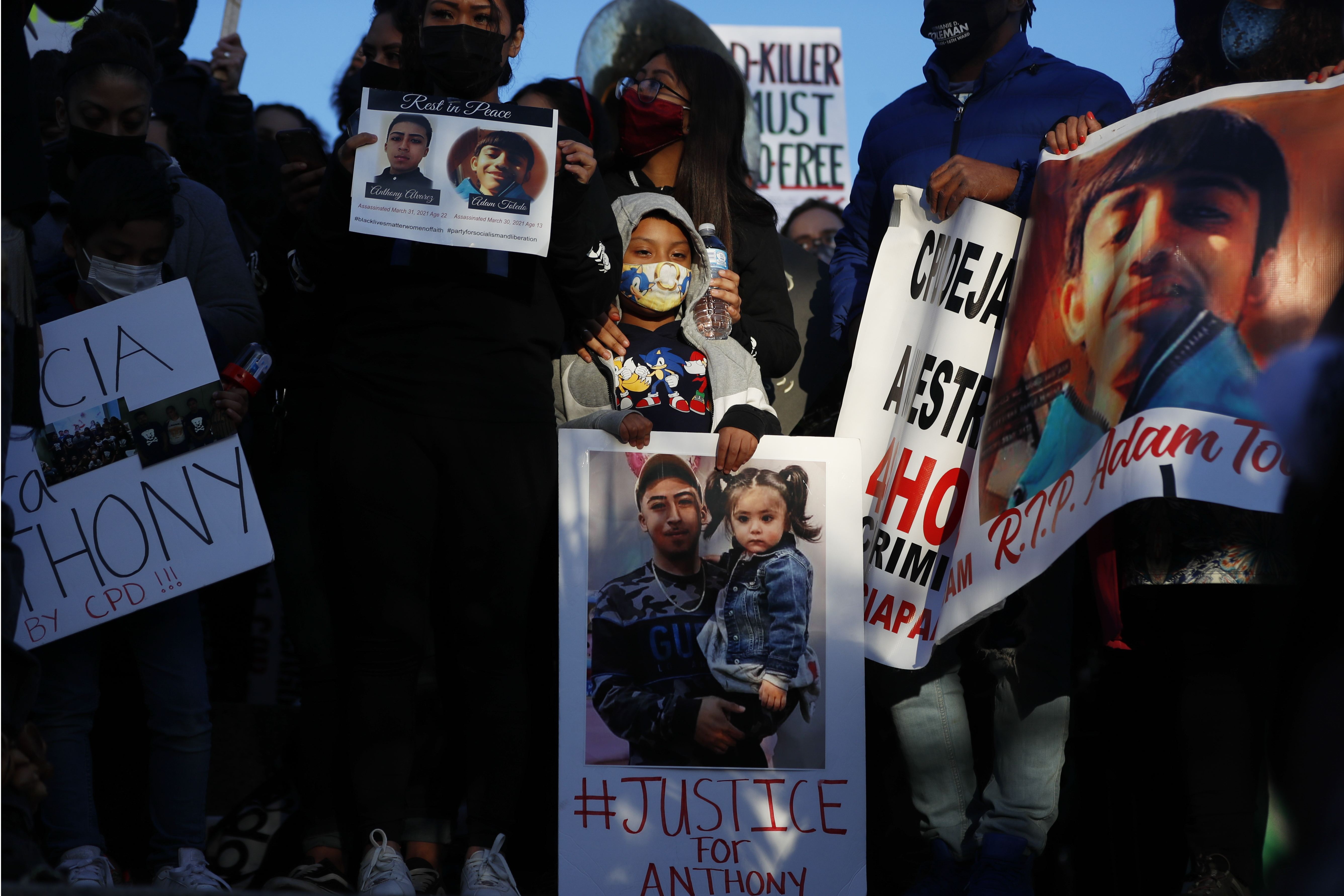 Demonstrators protest the fatal police shooting of 13-year-old Adam Toledo at an April 16, 2021, rally in Logan Park in Chicago. (Shafkat Anowar / Associaed Press)