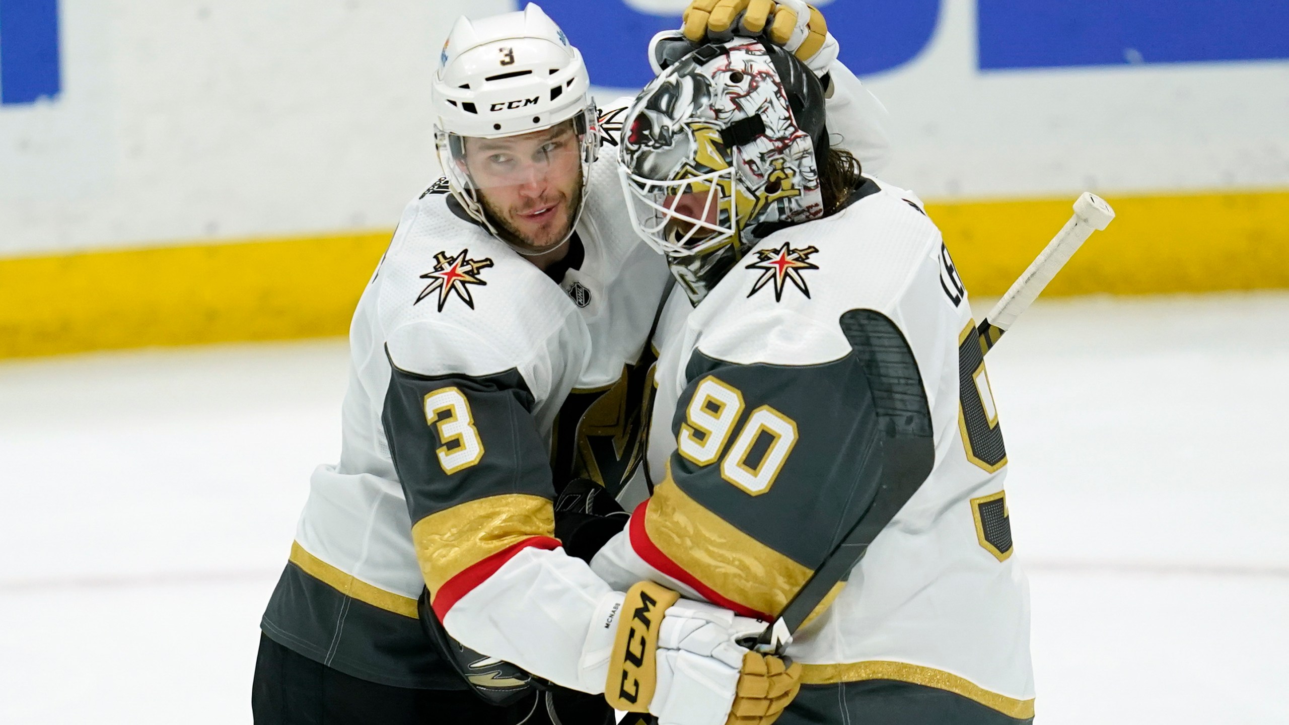 Vegas Golden Knights defenseman Brayden McNabb (3) and goaltender Robin Lehner (90) celebrate a 4-0 win over the Anaheim Ducks after their NHL hockey game in Anaheim on April 16, 2021. (Ashley Landis / Associated Press)