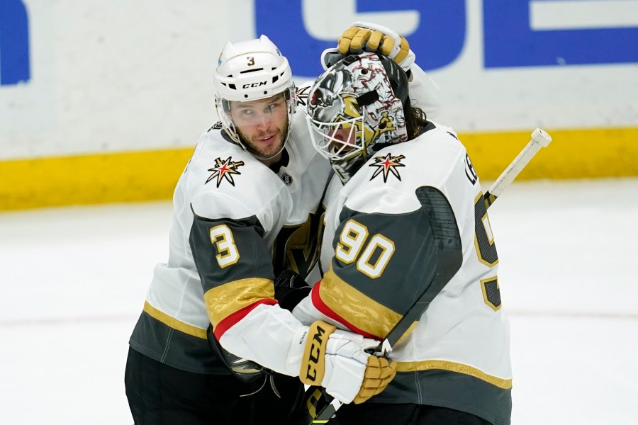 Vegas Golden Knights defenseman Brayden McNabb (3) and goaltender Robin Lehner (90) celebrate a 4-0 win over the Anaheim Ducks after their NHL hockey game in Anaheim on April 16, 2021. (Ashley Landis / Associated Press)