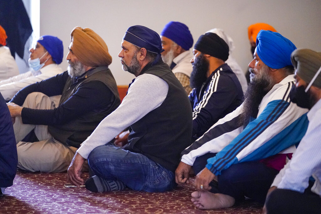 Members of the Sikh Coalition gather at the Sikh Satsang of Indianapolis in Indianapolis, Saturday, April 17, 2021 to formulate the groups response to the shooting at a FedEx facility in Indianapolis that claimed the lives of four members of the Sikh community. (AP Photo/Michael Conroy)