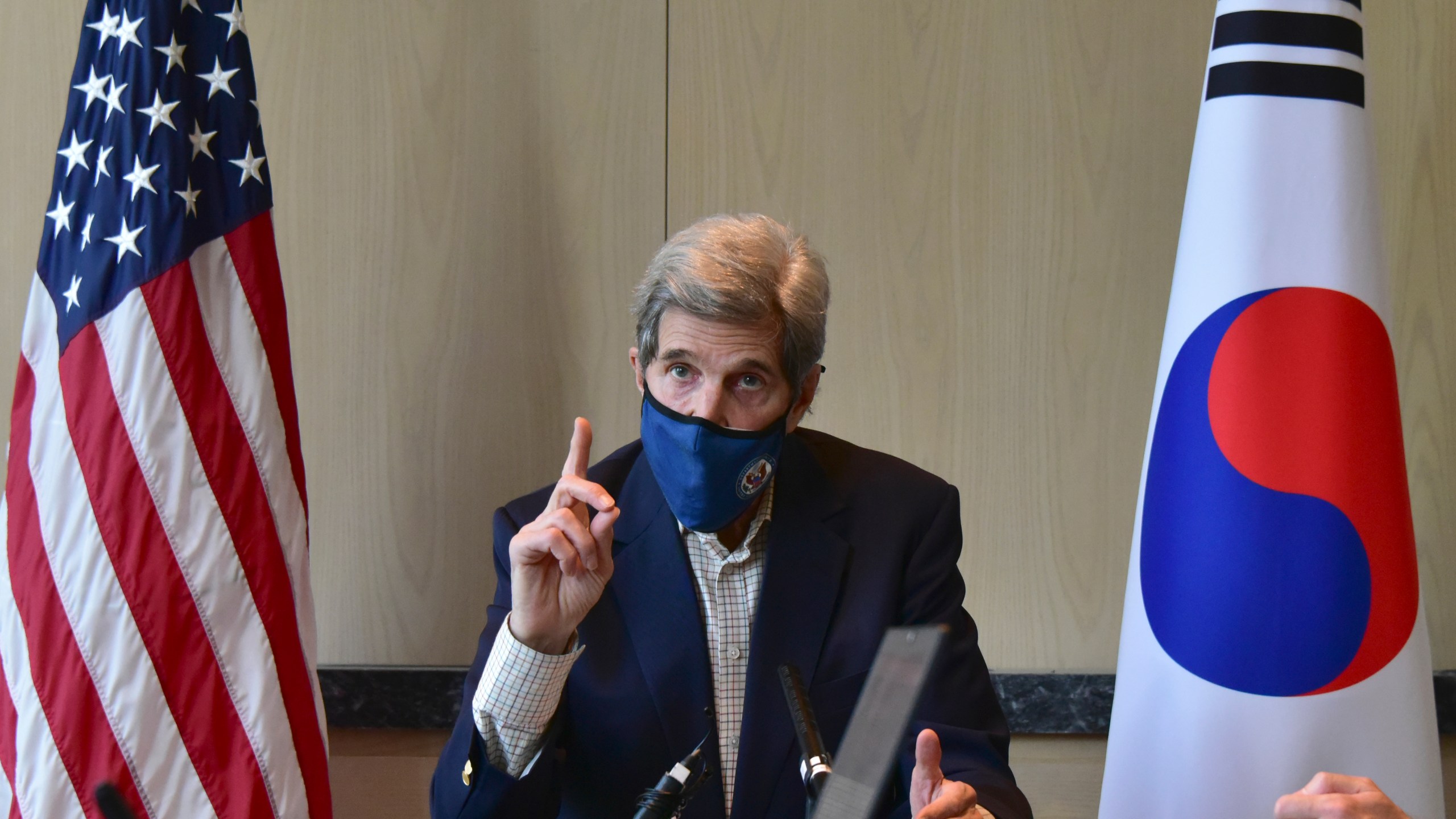 In this photo provided by U.S. Embassy Seoul, U.S. special envoy for climate John Kerry speaks during a round table meeting with the media in Seoul, South Korea, Sunday, April 18, 2021. (U.S. Embassy Seoul via AP)